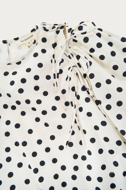 Top ballon à pois noirs et blancs avec nœuds et manches bouffantes