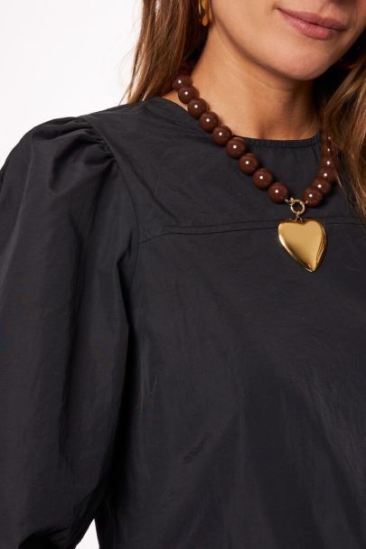 Zwarte jurk met lange pofmouwen