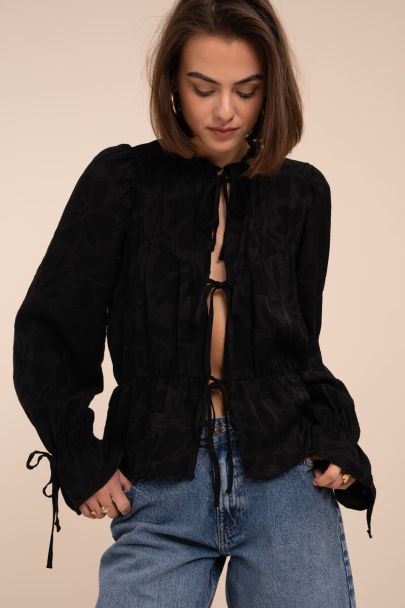 Zwarte jacquard top met strikjes en ruffle mouwen