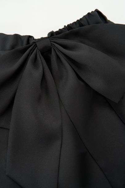 Black mini skirt with statement bow