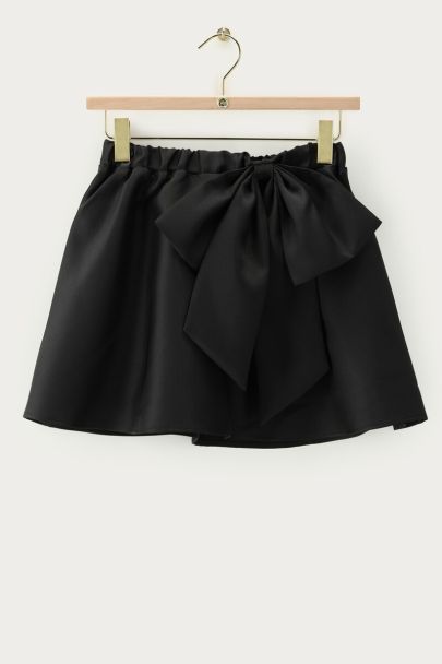 Black mini skirt with statement bow