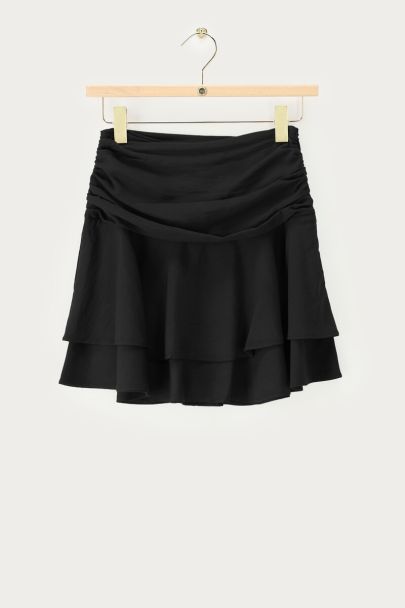 Zwarte rok met drapering