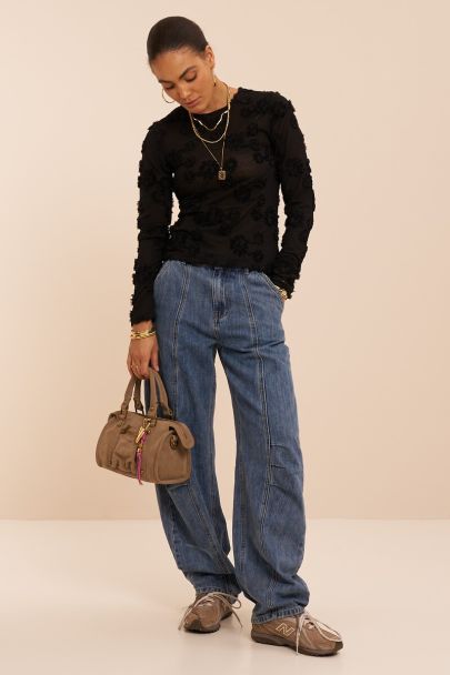 Black top with long sleeves and embroidered flowers