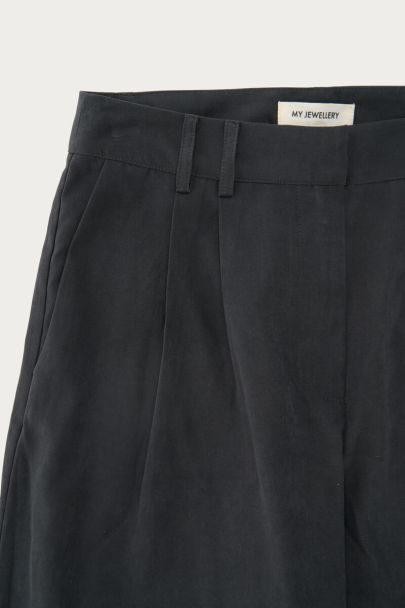 Black trousers with drawstring at the bottom
