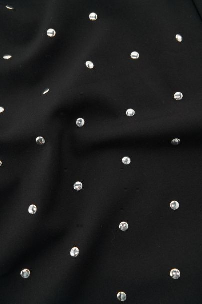 Black trousers with silver-coloured studs