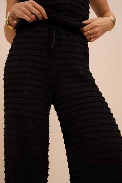 Zwarte wijde broek met elastische band en structuur