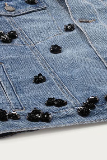 Blue denim vest with floral sequins