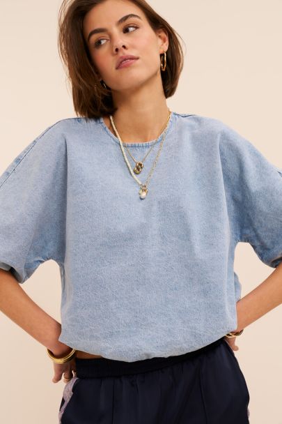 Blauwe denim top in ballon look