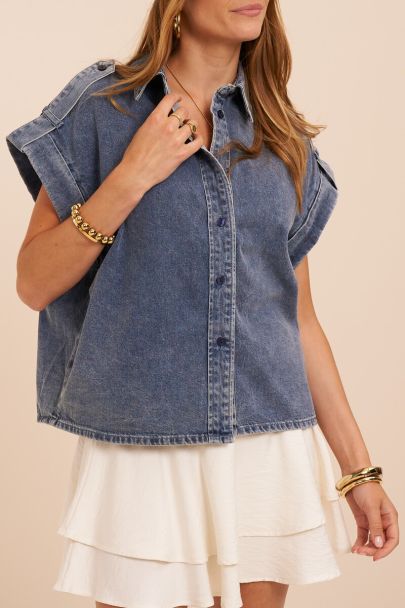 Blue denim top with rolled-up short sleeves