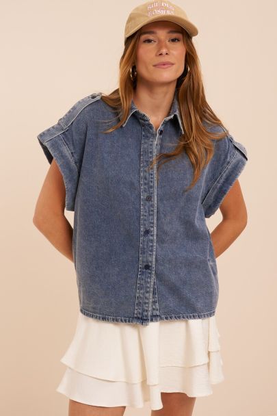Blue denim top with rolled-up short sleeves