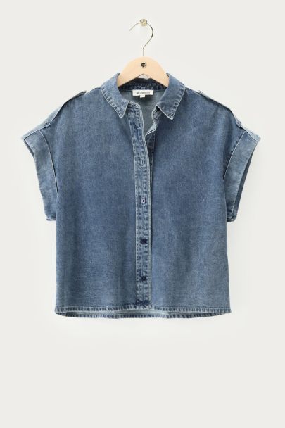 Blue denim top with rolled-up short sleeves