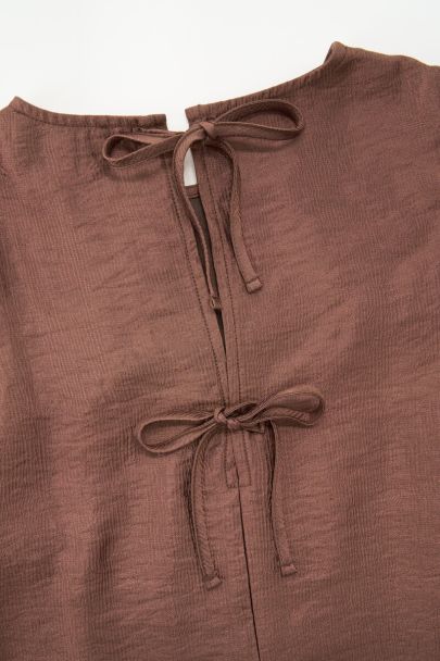 Bronze jurk met lange pofmouwen
