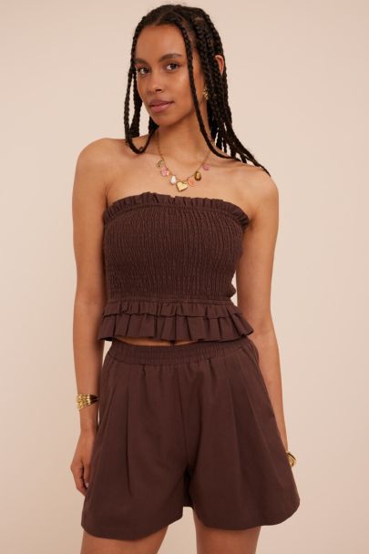 Bruine strapless top met ruffles