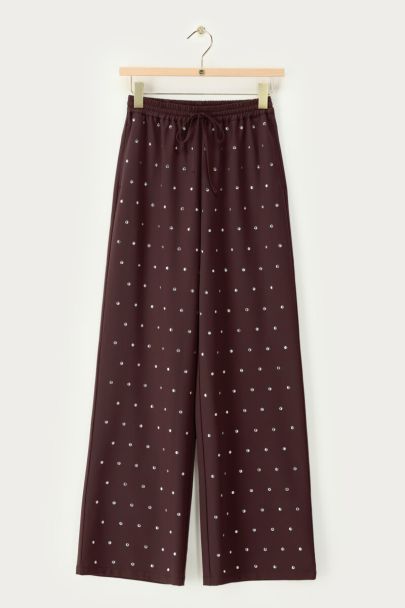 Dark brown trousers with silver-coloured studs