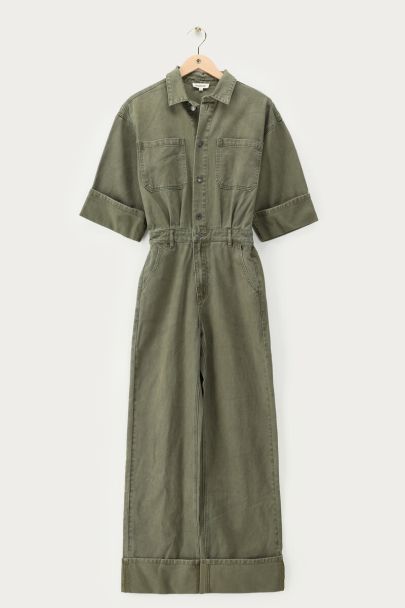Dark green denim jumpsuit with rolled-up sleeves
