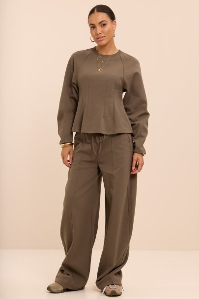 Dark green jogger trousers with drawstring