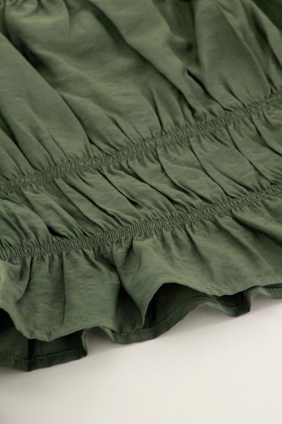Donkergroene off shoulder top met ruffles
