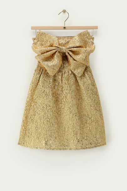 Goudkleurige jurk met strik