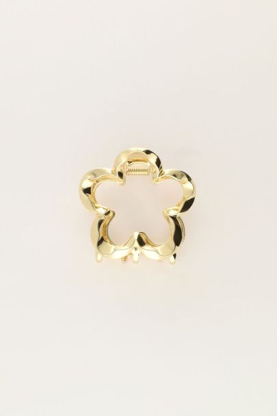 Gold coloured flower hair clip twisted