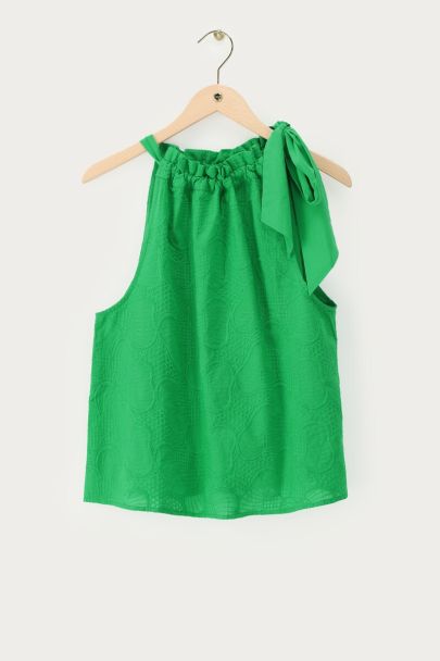 Green halter top with embroidery and bow