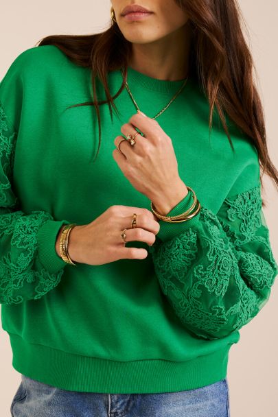 Green sweater with fancy embroidery sleeves