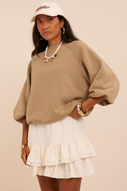 Green sweater with short puff sleeves in balloon look