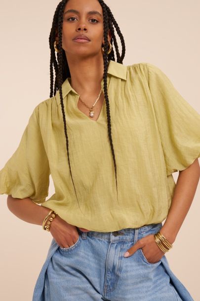 Green top with short balloon sleeves