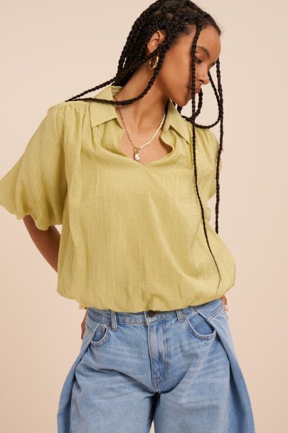 Green top with short balloon sleeves