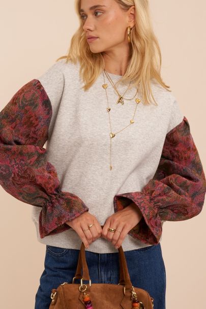 Sweat gris avec manches contrast&eacute;es en jacquard fleuri