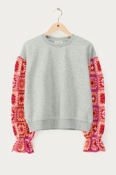 Grey sweater with pink crochet sleeves