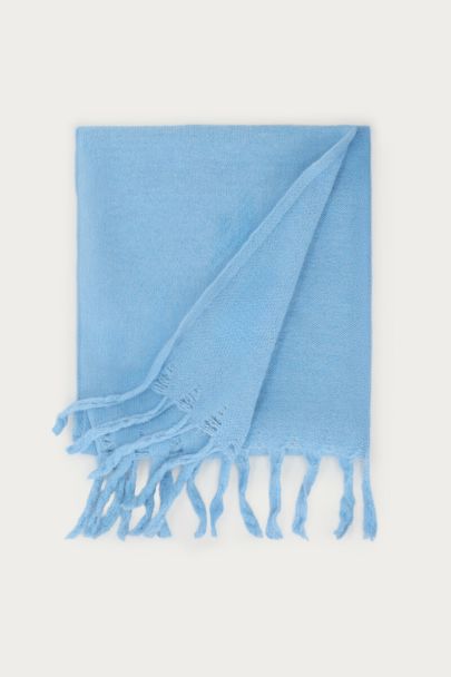 Light blue knitted scarf with fringe