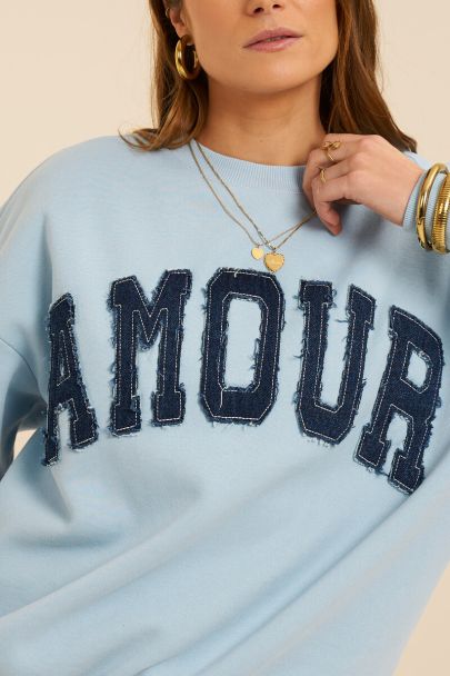 Light blue sweater with denim patch "Amour"