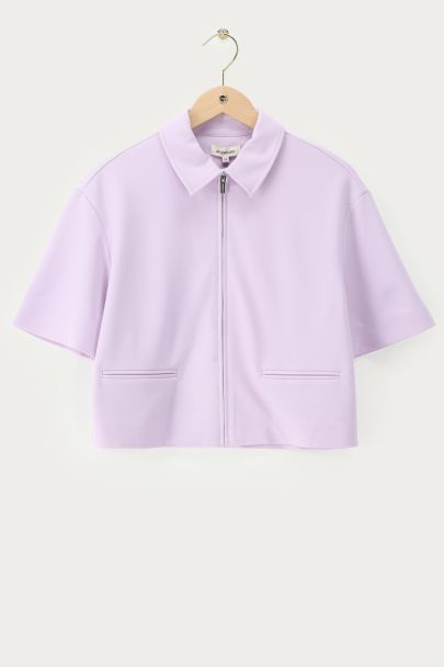 Polo zippé lilas à manches courtes