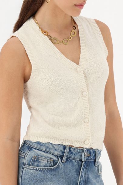 White vest with scalloped edge
