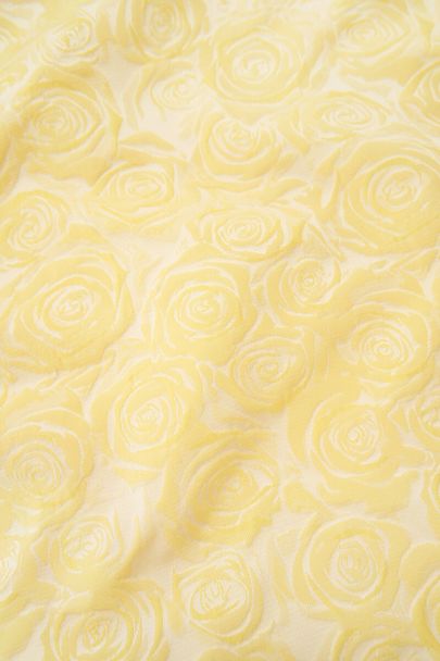 Gele top met bloemen reliëf en pofmouwen