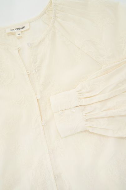 Beige top met ruffles en embroidery details