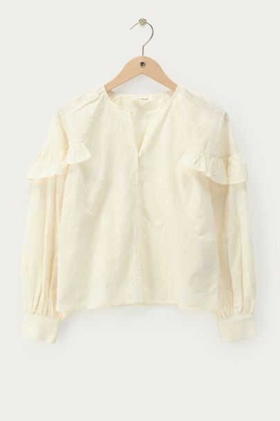 Beigefarbenes Oberteil mit Rüschen und Stickerei