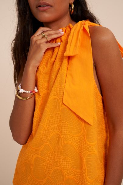 Oranje haltertop met embroidery en strik