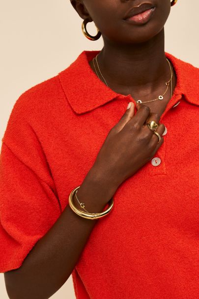 Oranje gebreide bouclé polo met korte mouwen