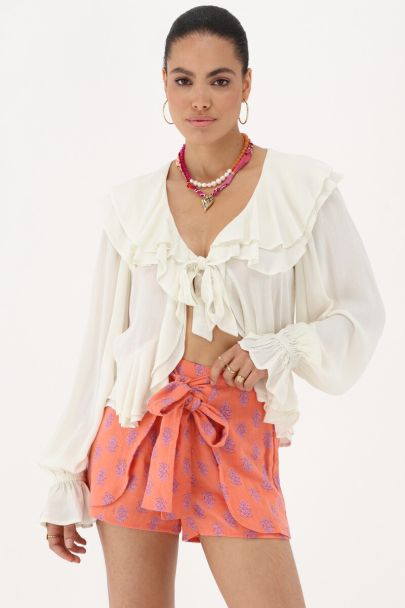 Orangefarbene Wickel-Shorts mit Muster