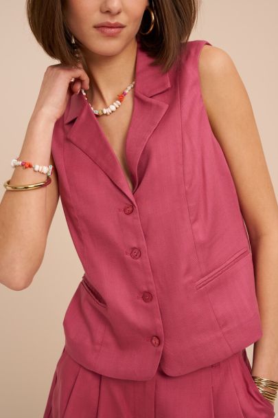 Roze gilet met knopen