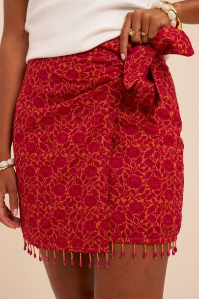 Jupe rose &agrave; imprim&eacute; floral et perles fantaisie