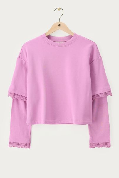 Roze sweater met dubbele mouwen en kanten details