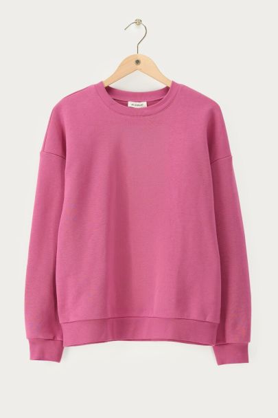 Sweat rose à franges avec écusson