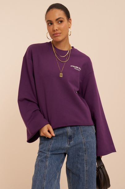 Paarse boxy sweater met backprint 'Rue des rosiers'