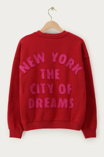 Red sweater "City of dreams"