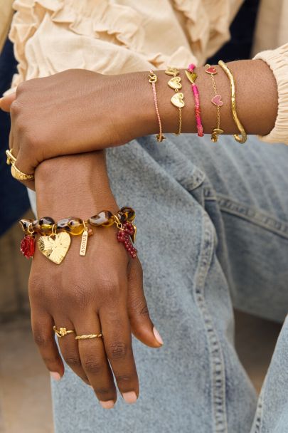 Perlenarmband mit Leopardenmuster und Anhängern