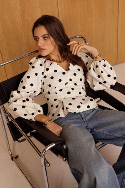 Top blanc à pois noirs avec fermeture à glissière