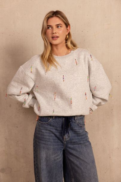 Light grey sweater with coloured beaded fringes