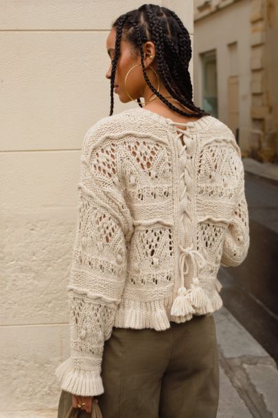 Beige knitted sweater in boho style